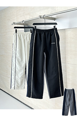 バレンシアガ Balenciag アルファベットロゴ刺繍対照色ステッチナイロンパンツ