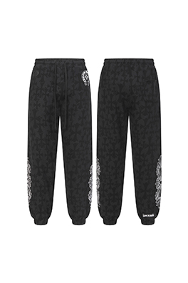 クロムハーツ ダークな模様のサンスクリット文字プリントのズボン