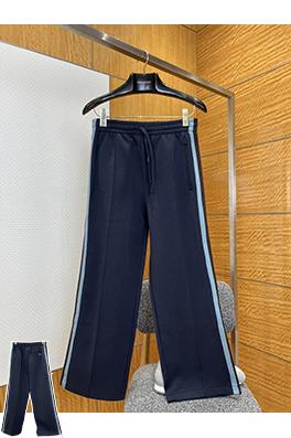 アミリコピー カラーブロックのサイドストライプ入りストレートレッグニットスウェットパンツ