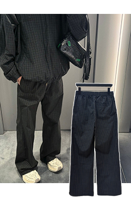 バレンシアガ チェック柄のワイドレッグパンツ