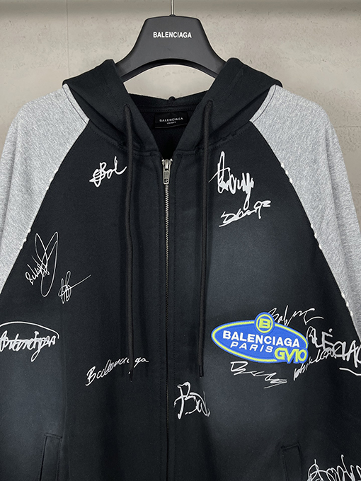 バレンシアガ ウォッシュダメージした手描きのグラフィティのフード付きジップアップスウェットシャツ