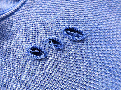 セントマイケル にキャラクターの頭を彩色の古したパーカー