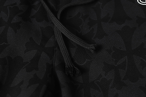 クロムハーツ ダークな模様のサンスクリット文字プリントのズボン