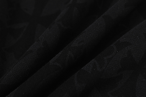 クロムハーツ ダークな模様のサンスクリット文字プリントのズボン