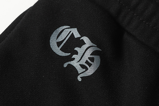 クロムハーツ サンスクリット文字プリントの白いカジュアルパンツ