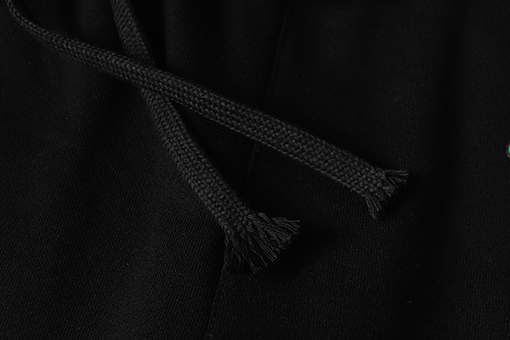 クロムハーツ サンスクリット文字プリントの白いカジュアルパンツ