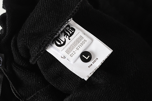 クロムハーツ サンスクリット文字プリントの白いカジュアルパンツ