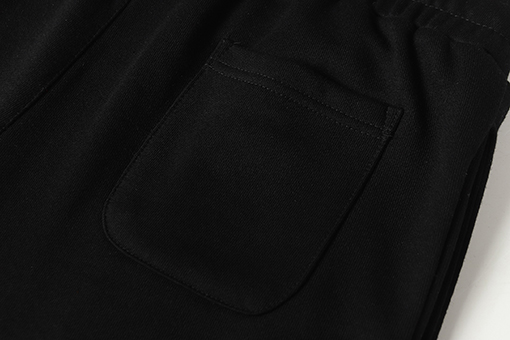 クロムハーツ サンスクリット文字プリントの白いカジュアルパンツ