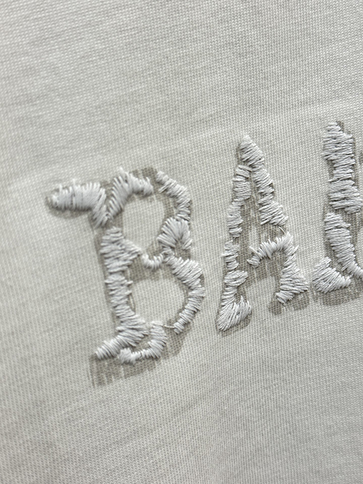 バレンシアガ BALENCIAGA ダイレクトプリントのタッセルアップリケ刺繍入り半袖Tシャツ