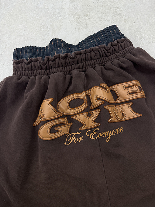 アクネストゥディオズ Acne Studios レザーアップリケ刺繍りダブルウエストバンドスウェットパンツ