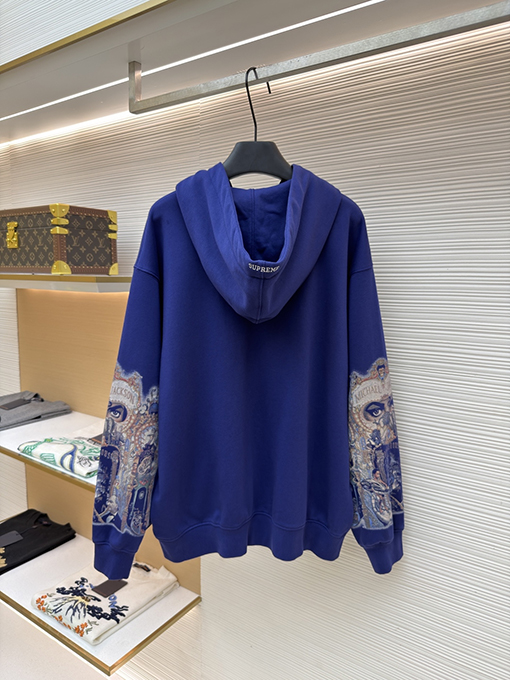 シュプリームスーパーコピー 袖に目のプリント入りコラボレーションデザインのフード付きジップアップスウェットシャツ