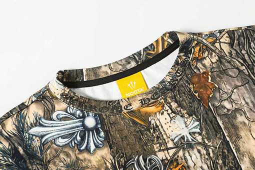 クロムハーツ x ナイキ x ドレイクノクタスーパーコピー 全体に馬蹄形のサンスクリット文字がプリントされた長袖シャツ