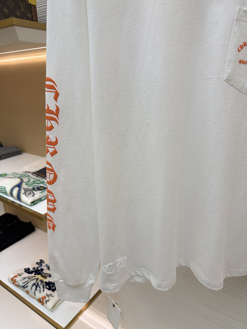 クロムハーツスーパーコピー スタイリッシュなオレンジ色のサンスクリット語ロゴ入り長袖シャツ