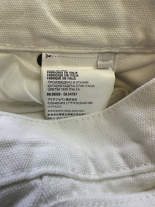 プラダブランドスーパーコピー 三角形の革製ワークジーンズ