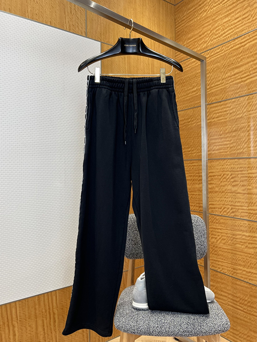 バレンシアガ サイドストライプ柄のワイドレッグカジュアルパンツ