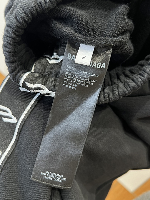 バレンシアガ サイドストライプ柄のワイドレッグカジュアルパンツ