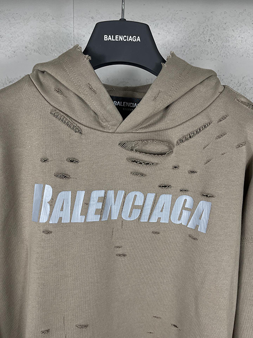 バレンシアガ パーカー BALENCIAGA スーパーコピー アートデザインの裂け目と裏地付きフード付きスウェット