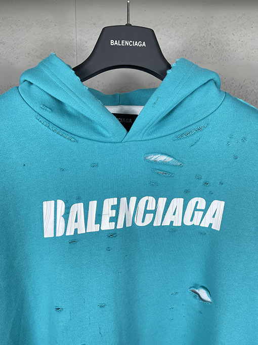 バレンシアガ パーカー BALENCIAGA スーパーコピー アートデザインの裂け目と裏地付きフード付きスウェット