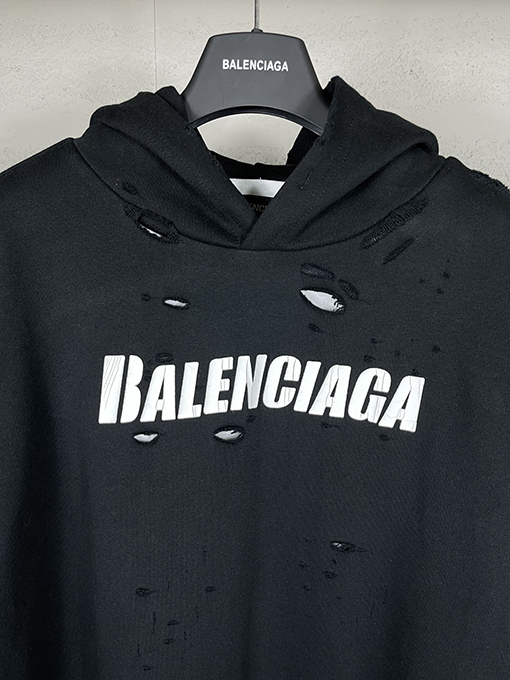 バレンシアガ パーカー BALENCIAGA スーパーコピー アートデザインの裂け目と裏地付きフード付きスウェット