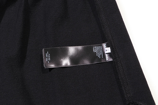 バレンシアガ  英字ロゴ刺繍入りロングパンツ