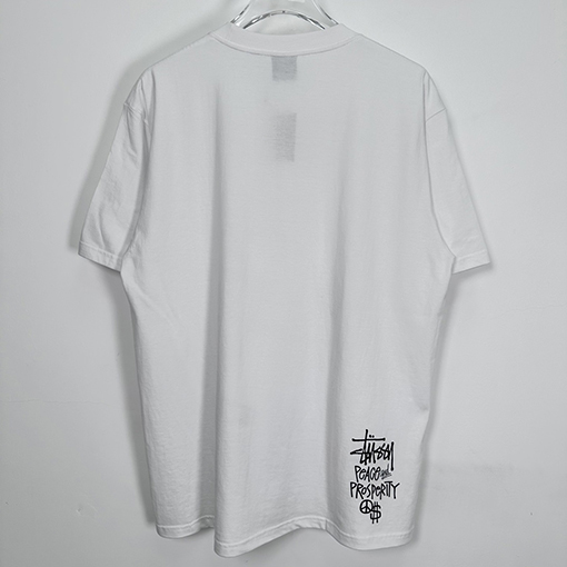 ステューシー  平和と繁栄の漫画のキャラクター半袖Tシャツ