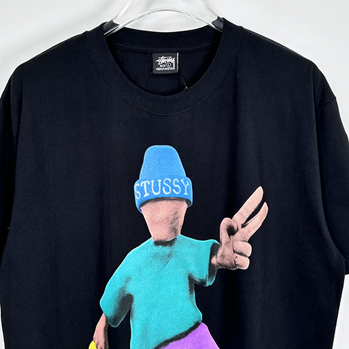 ステューシー  平和と繁栄の漫画のキャラクター半袖Tシャツ