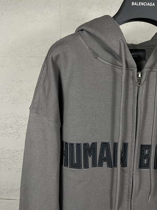 バレンシアガ HUMAN BEING 刺繍パッチ付きフード付きジップアップスパーカー