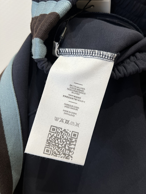 アミリコピー カラーブロックのサイドストライプ入りストレートレッグニットスウェットパンツ